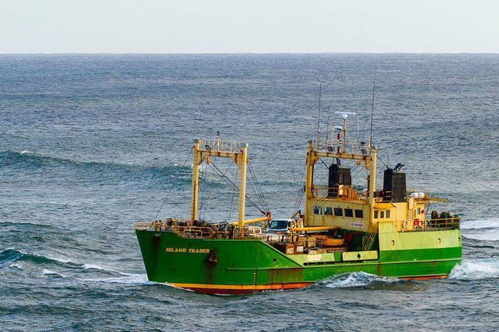 MV Island Trader ship with green bow and yellow top